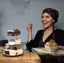 Photo of business owner with vegan cupcakes