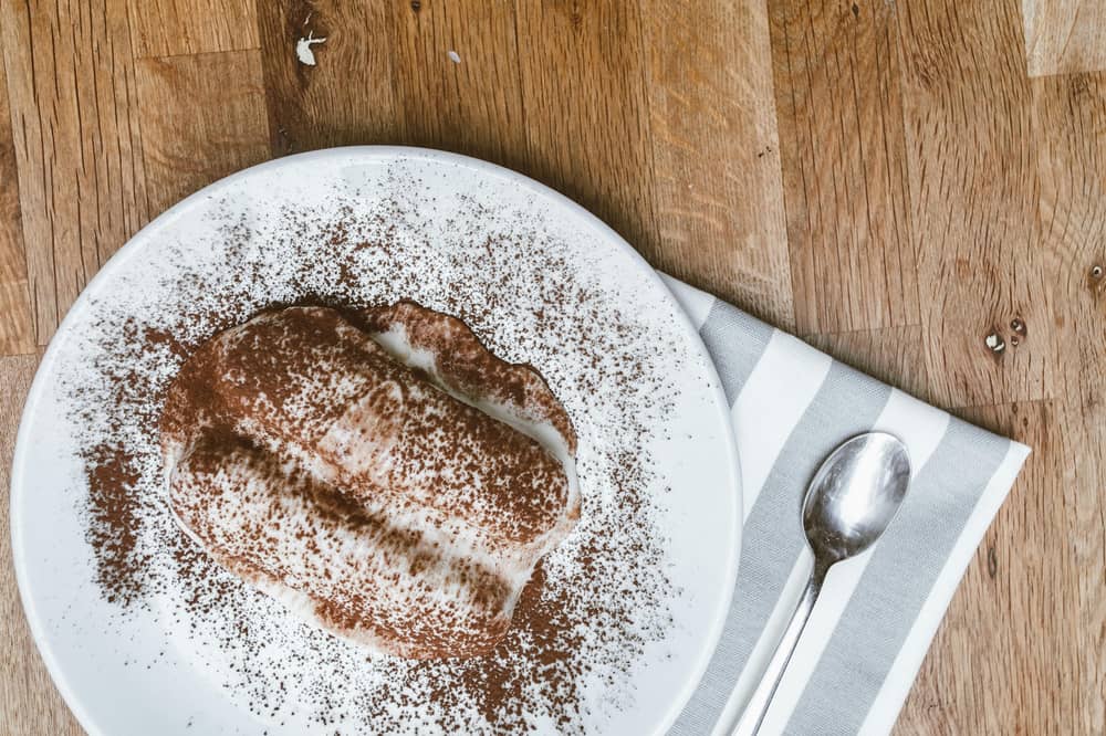 A video of people eating tiramisu straight out of a compartment in their car has went viral. 