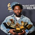 Kendrick Lamar poses with the Record Of The Year, Best Rap Performance, Song Of The Year, Best Music Video, Best Rap Song awards in the press room during the 67th Annual Grammy Awards.     