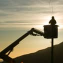 A BT worker fixs telephone lines (Photo: Ashley Cooper/Construction Photography/Avalon/Getty Images)
