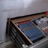Criminals had built a secret room behind a fake radiator which hid a deep drawer full of illegal tobacco products. 