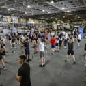 Here are all the details about the Royal Navy's Pre-Joining fitness test, and how you can beat it. Pictured are HMS Queen Elizabeth's ship's company take part in circuits in the hangar.
