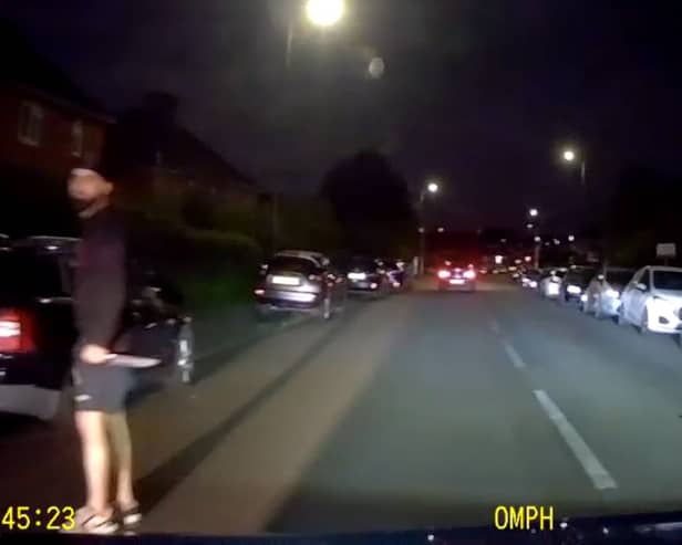 Murder victim drives away from his killer who is still grasping knife.