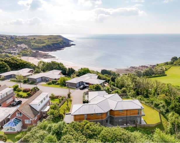 The Gower Peninsula in Swansea is one of the best places to live in the UK, according to the Sunday Times. This fabulous four-bedroom house looks out over Langland Bay, with its lovely sunny beach, and the nearby golf course.