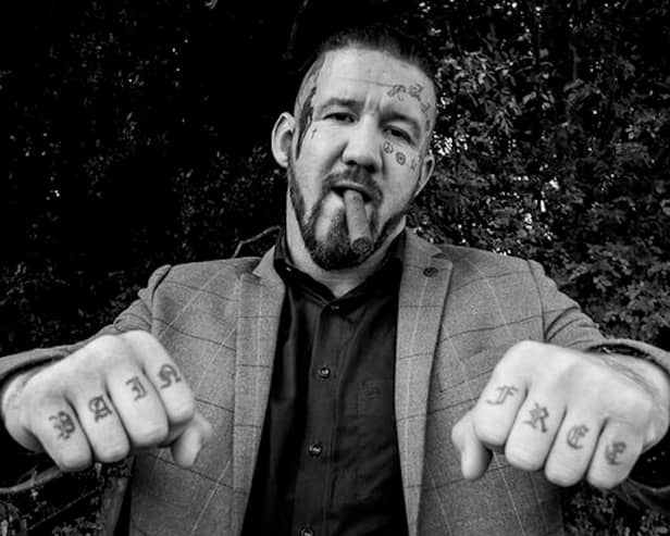 Bare knuckle fighter poses for photograph
