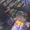 Balaclava-clad teen threatens shop owner at knifepoint.
