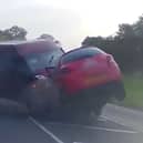 Minibus smashes head-on into car - seriously injuring three.