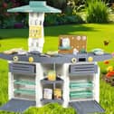 The Dolu play kitchen is durable enough to be used in the garden 