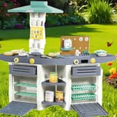 The Dolu play kitchen is durable enough to be used in the garden 