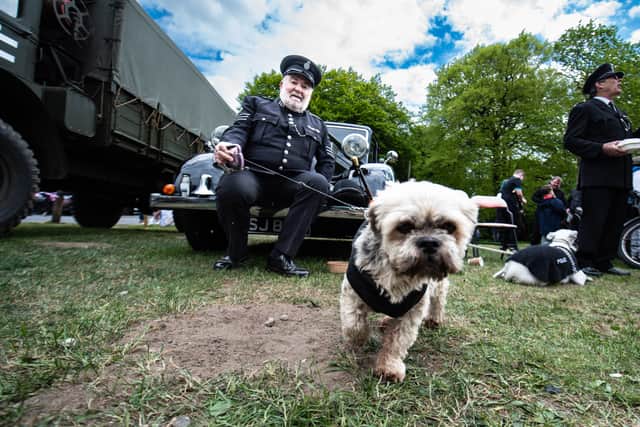 1940s police re-enactor Jim Stott with one of his 'police' dogs at Blackburn's VE80 festival