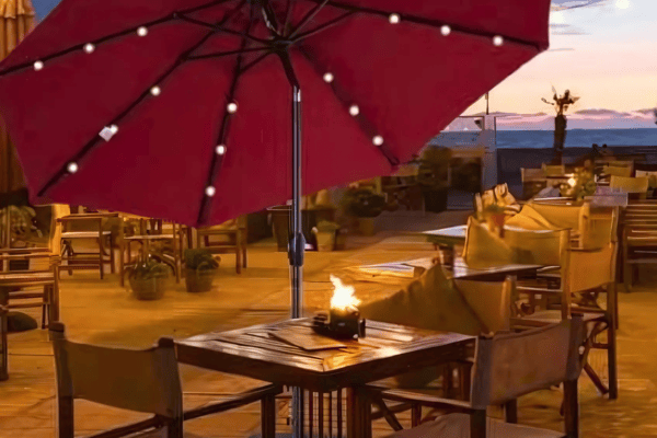 The Outsunny parasol with solar-powered LED lights creates a cosy and inviting glow for evening gatherings