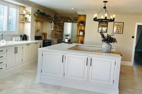 Mrs Hinch uses adjustable organisers to keep things like food neatly organised in her kitchen (pictured).