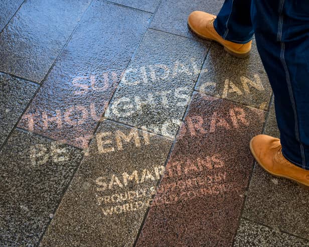The quotes were made using reverse graffiti, and appear on pavements across London