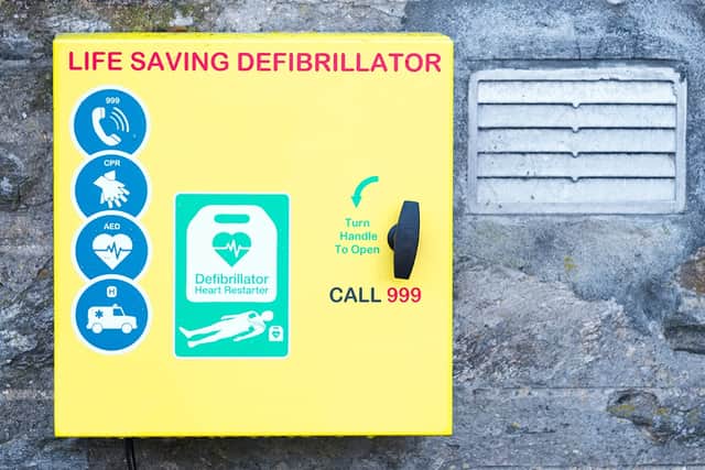 Defibrillator on wall in town in UK