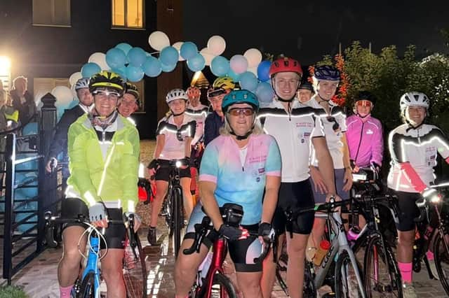 Alice's Mum, Libby, prepares to lead a group of cyclists out from  the Old Dalby start