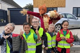 Frisby Cofe Pupils with a scarecrow