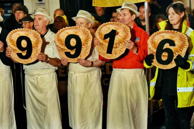 Staff from Melton's Dickinson and Morris Ye Olde Pork Pie Shoppe show off the latest fundraising total for Children In Need from the Rickshaw Challenge EMN-191114-111830001
