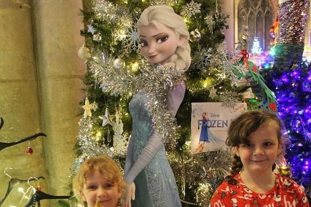 Evie Moore (right) and sister Freya near the Regal Cinema tree at Melton Christmas Tree FestivalPHOTO PHIL BALDING EMN-191129-080421001
