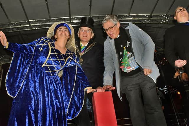 Pantomime cast member Bessie McMillan, mayor Malise Graham and Rev Kevin Ashby on plunger duty PHOTO: Tim Williams