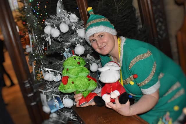 Church member Lisa Taylor with her Christmas tree PHOTO: Tim Williams
