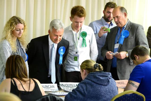 656464-12 : ©Lionel Heap : News : Rutland & Melton Parliamentary Election Count 2017 : Candidates and their agents watch the count. Sir Alan Duncan (Conservative) and Alastair McQuillan (Green Party) (centre). EMN-191112-105513001