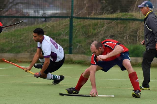 John Judge takes evasive action in a feisty derby game EMN-200225-111005002