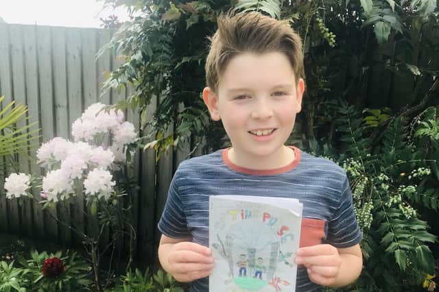 Melton schoolboy Jonasz Bettinson with his book which has raised nearly £1,000 for the NHS EMN-200625-162415001