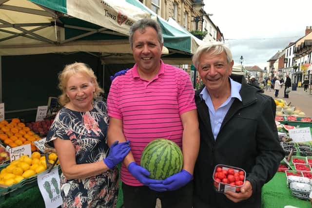 Mark Shaw and his parents, Mary and Pete, pictured on their fruit and veg stall on their last day of trading on Melton street market on Saturday EMN-200629-100349001