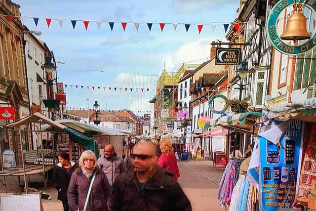 James Wilks wanders through his home town, Melton, on market day during The Game Changers movie EMN-200630-165412001