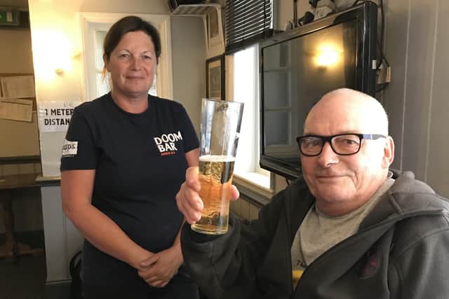 Geoff Carlisle, a regular at The Grapes in Melton, pictured with landlady Sharon Brown EMN-200707-170721001