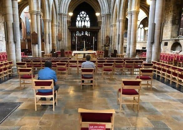 Private prayer in St Mary's Church, Melton, with social distancing measures in place EMN-200713-174147001