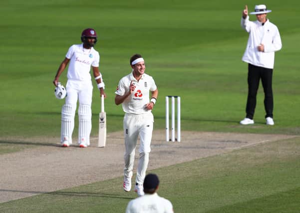 MANCHESTER, ENGLAND - JULY 26: Stuart Broad of England celebrates after taking the wicket of Kemar Roach of West Indies during Day Three of the Ruth Strauss Foundation Test, the Third Test in the #RaiseTheBat Series match between England and the West Indies at Emirates Old Trafford on July 26, 2020 in Manchester, England. (Photo by Michael Steele/Getty Images) 775534511