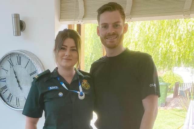 Paramedic Caitlin Sparling and her police office brother Lewis in their uniforms EMN-200408-152524001