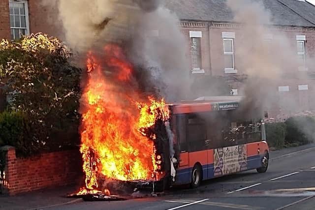 Flames rise from a bus after it caught fire in Long Clawson last night
PHOTO Simon Majury EMN-200731-090025001