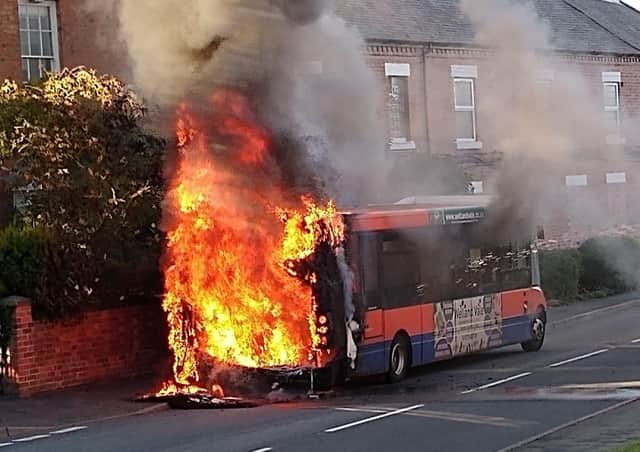 Flames rise from a bus after it caught fire in Long Clawson last night
PHOTO Simon Majury EMN-200731-090025001