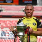 George Thomson, who grew up in Melton, pictured with the National League play-off final trophy at Wembley following Harrogate Town's victory EMN-200508-121949001