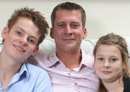 The late Stew Sparling with children Lewis and Caitlin EMN-200508-101317001