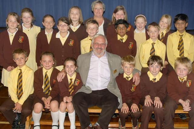 Music teacher Mirander Willder and members of Melton's St Francis Primary School Choir with the late Eric Sylt, of Melton Rotary. The choir was runner-up in the Sing Up Melton competition in 2011
PHOTO: Tim Williams EMN-201108-101438001