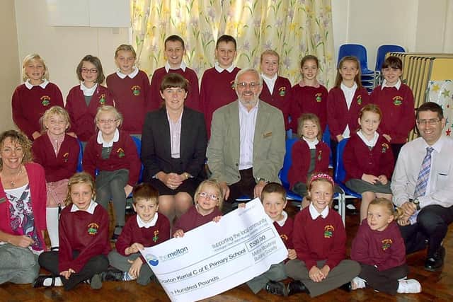 Croxton Kerrial School choir, winners of Sing Up Melton 2011 with teacher Rachel Davidson, left, Karen Middleton of sponsors The Melton building society, the late Eric Sylt of Melton Rotary and the then Melton Times editor Michael Cooke PHOTO: Tim Williams EMN-201108-101533001