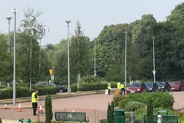 Residents queue to be tested at Melton's new Covid-19 test site outside the borough council offices EMN-201208-103721001