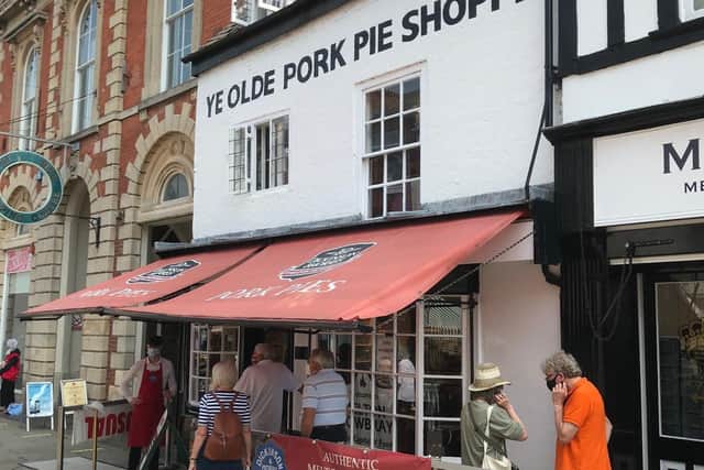 Facemasks being worn by staff and customers at Melton's iconic Dickinson and Morris Ye Olde Pork Pie Shoppe EMN-201208-103710001