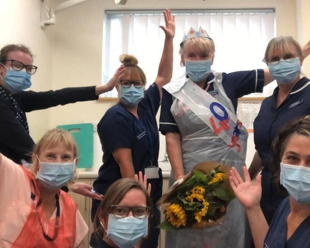 Latham House Medical Practice, Amanda Youle, is congratulated by colleagues after completing 40 years in the job EMN-200813-101416001