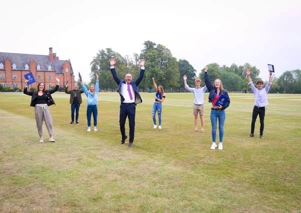 Students at Ratcliffe College celebrate their A-level results with headmaster, Jonathan Reddin EMN-200813-152609001
