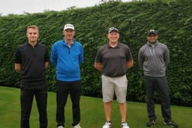 Golfers prepare to tee off at the Pork Pie Open.