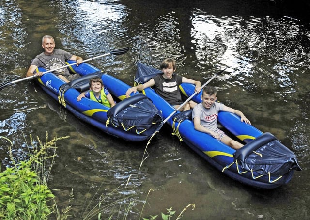 A father and sons enjoy a recent boating trip on the River Eye through MeltonPHOTO DEREK WHITEHOUSE EMN-200827-131359001
