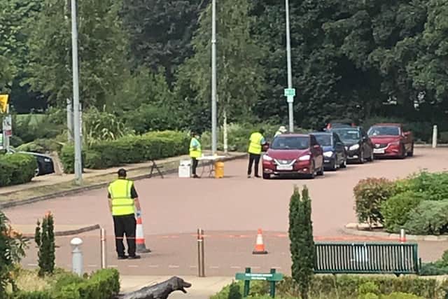 Residents queuing to be tested at Melton's recent mobile Covid-19 test site outside the borough council offices EMN-200827-164105001