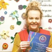 Leah Reek proudly shows off her certificate after she was officially recognised for her voluntary work for LOROS EMN-200309-172335001
