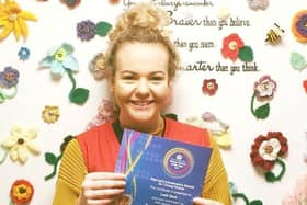 Leah Reek proudly shows off her certificate after she was officially recognised for her voluntary work for LOROS EMN-200309-172335001