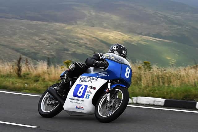 A motorcycle racer competing on the Isle of Man taken by Nicol Picksley.One of the best images taken by Melton Mowbray Photographic Society members last year EMN-201109-151524001