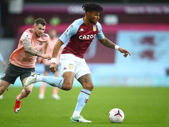 Burke gives chase at Aston Villa. Photo: Getty Images